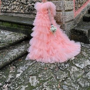 Peachy gown. Very pretty for pictures ! Tailored to fit like a medium for bust.